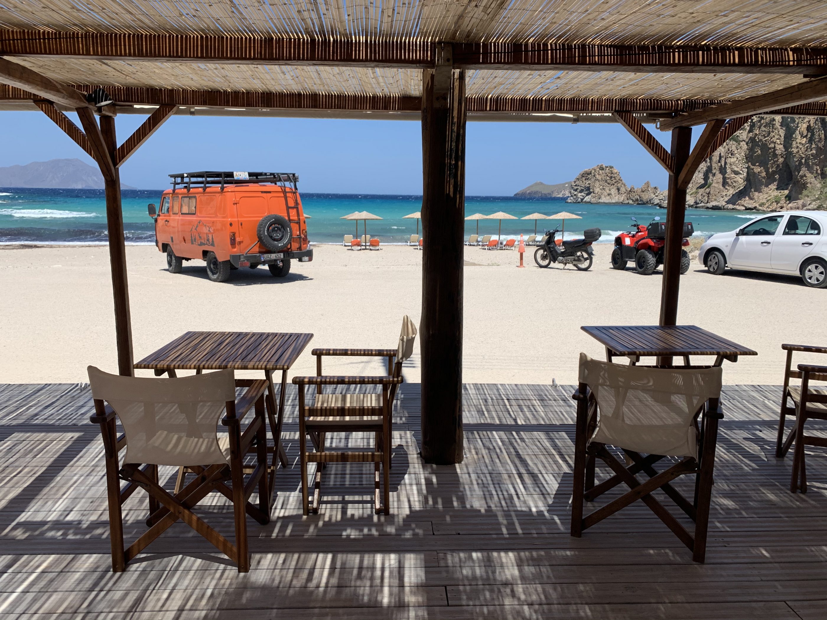 Italian man’s adventurous 18 month, 40,000km European vanlife road-trip in his orange Russian van 9 UAZ van on the beach in Milos