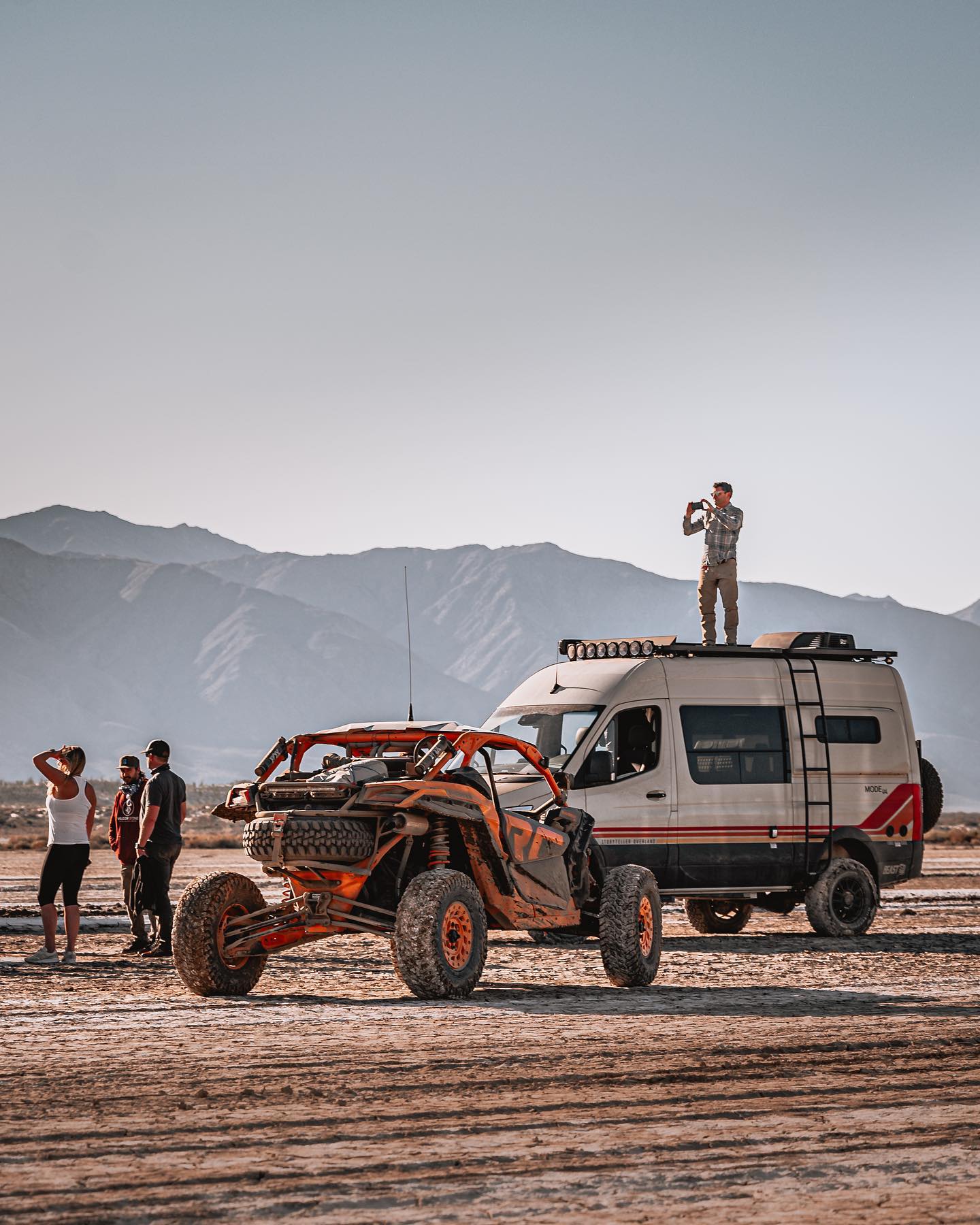 Is This 4x4 Mercedes Sprinter The Pinnacle Of Off Road VanLife Luxury? 7 Man stands on roof of campervan