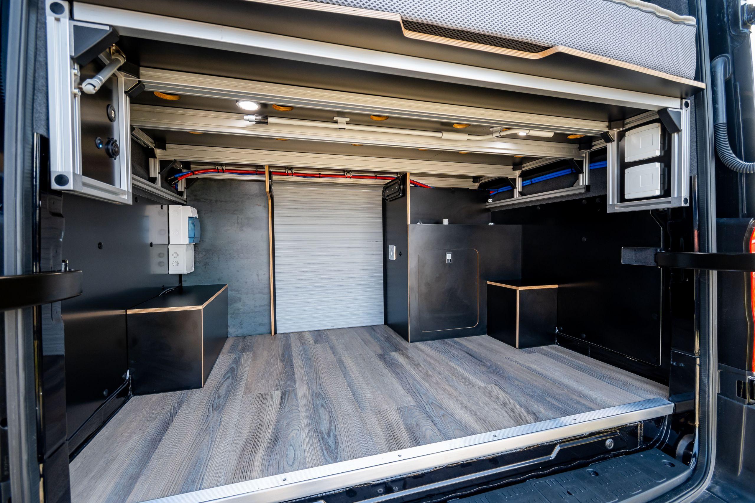 The Maxtraxx 4x4 Off-Grid Camper Conversion By Vanworx, Is The Ultimate Zombie Escape Vehicle! 7 Garage space under the double bed