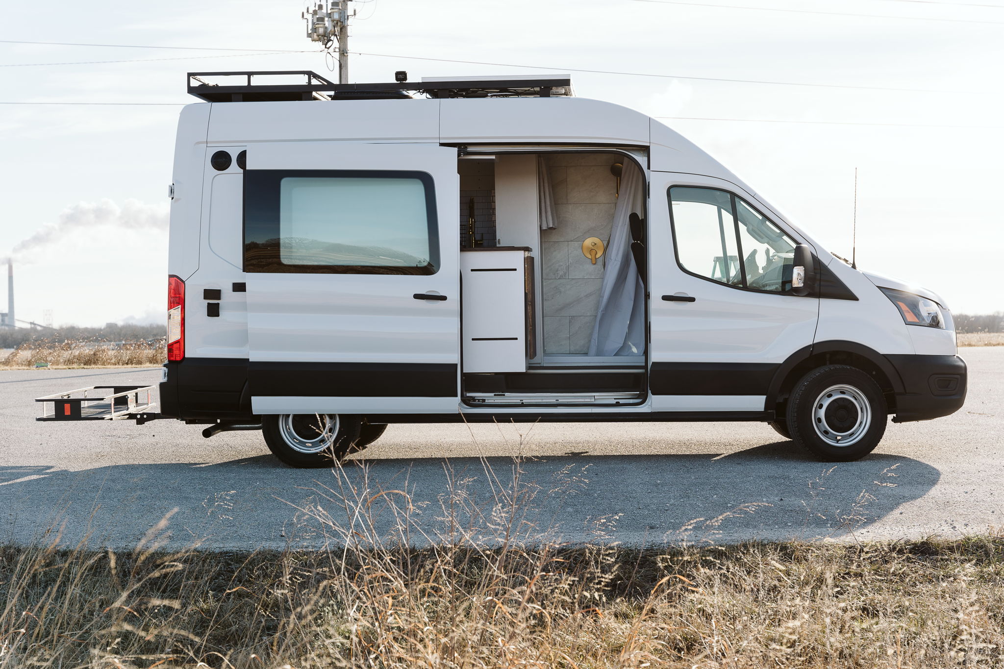 This Professional Conversion Is Perfect For Vanlife In USA | Everest Conversions 13 Side view transit vanlife
