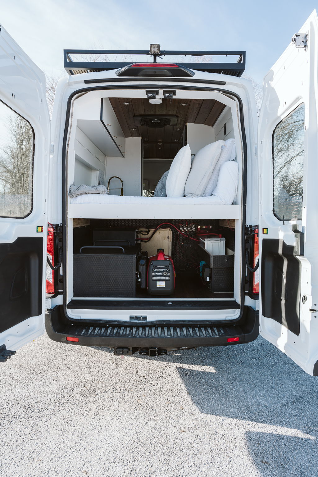 This Professional Conversion Is Perfect For Vanlife In USA | Everest Conversions 15 rear view transit vanlife