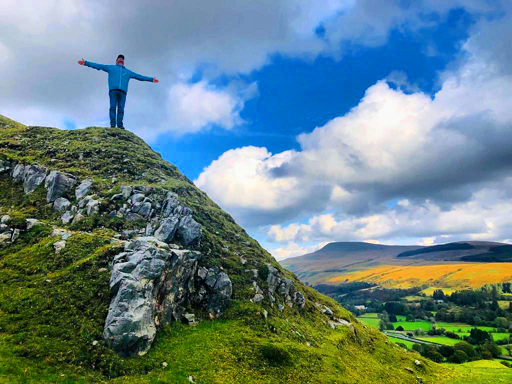 Why Are People Turning To Vanlife (2022) | The New Normal 7 Calamity Shane standing on a mountain top in the sunshine