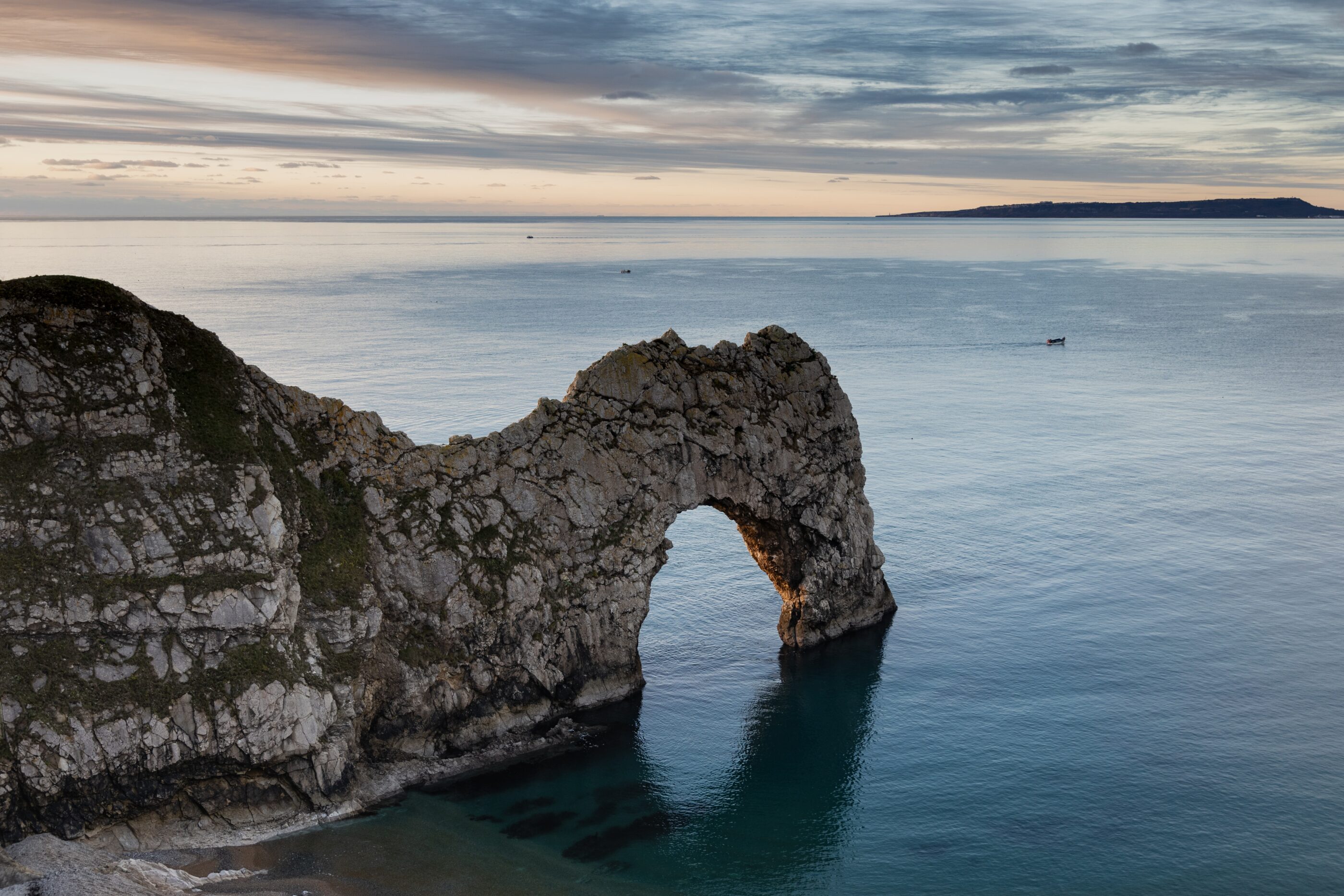 A beautiful picture of a sea landscape feature a rocky shore of Durdle Door in Wareham in UK